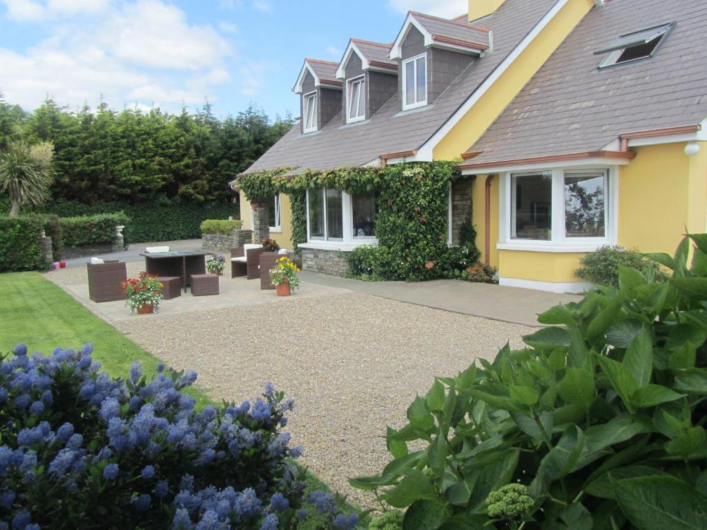 a house with a garden with purple flowers at Edencrest B&B in Bantry