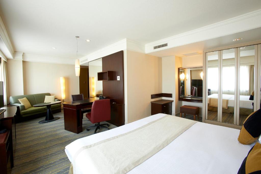 Postel nebo postele na pokoji v ubytování Royal Park Hotel