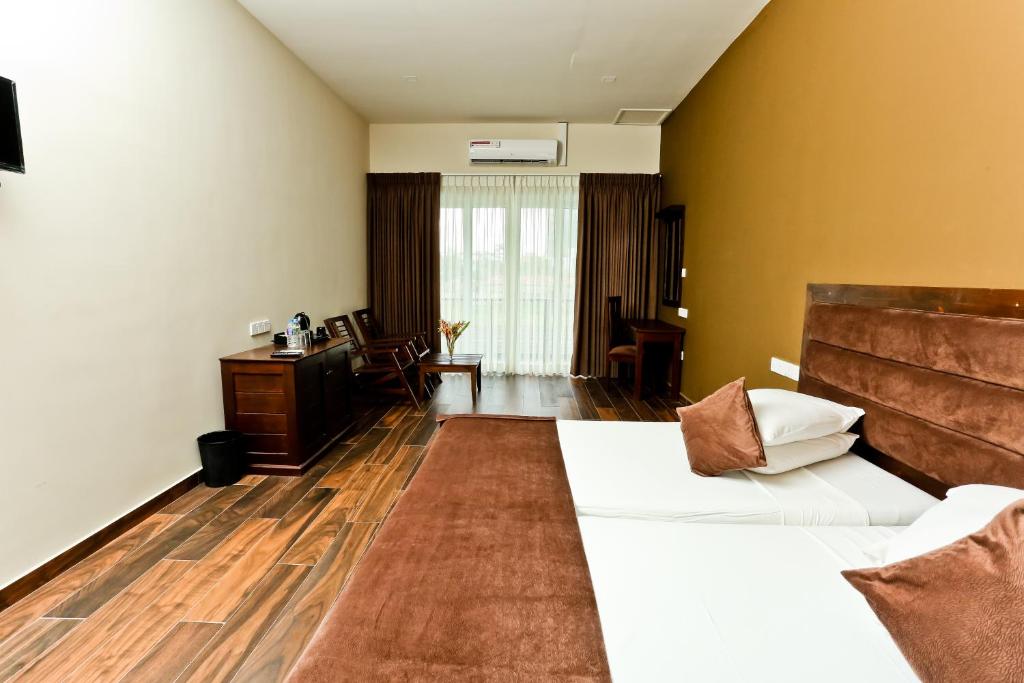 Postel nebo postele na pokoji v ubytování Golden Star Beach Hotel