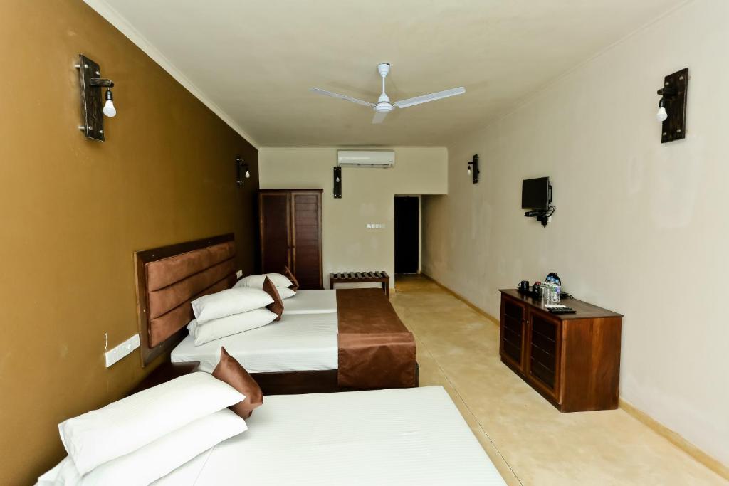 Postel nebo postele na pokoji v ubytování Golden Star Beach Hotel