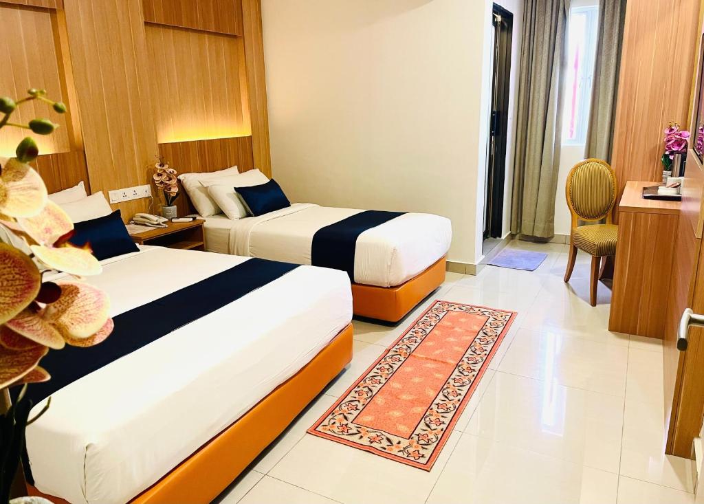 Postel nebo postele na pokoji v ubytování ESSY Hotel KL Sentral