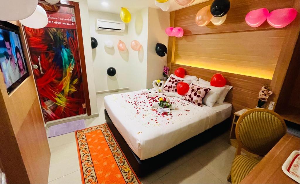 Postel nebo postele na pokoji v ubytování ESSY Hotel KL Sentral