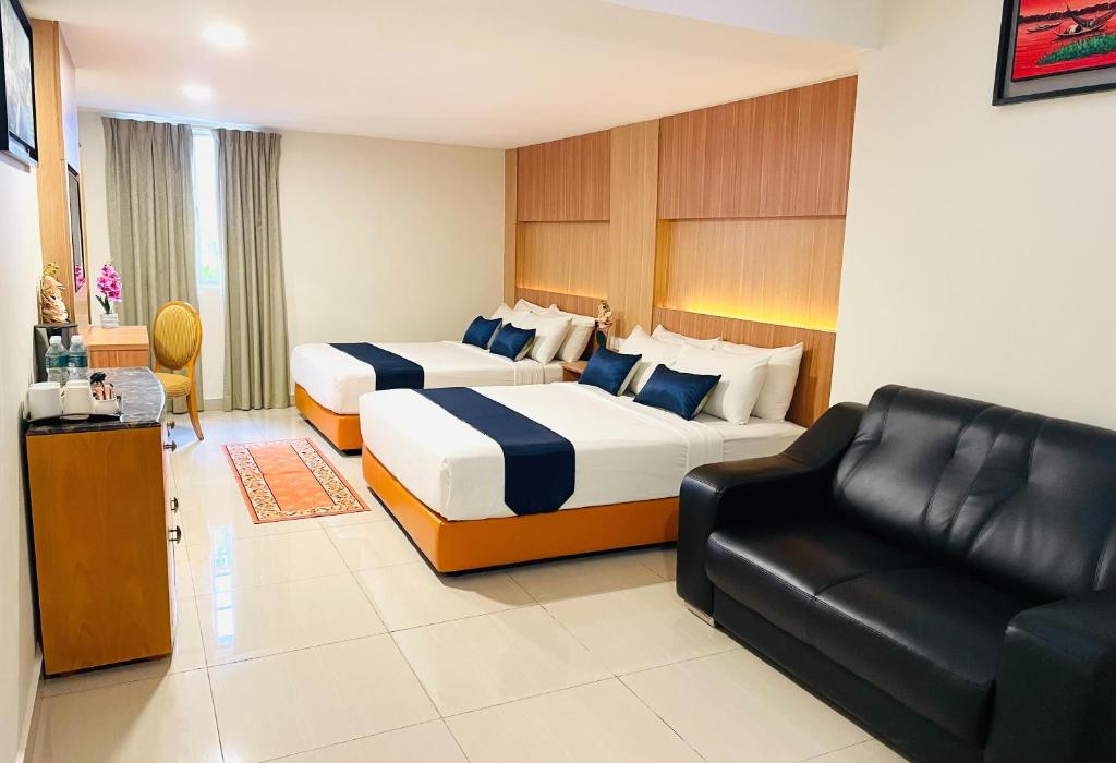 Postel nebo postele na pokoji v ubytování ESSY Hotel KL Sentral