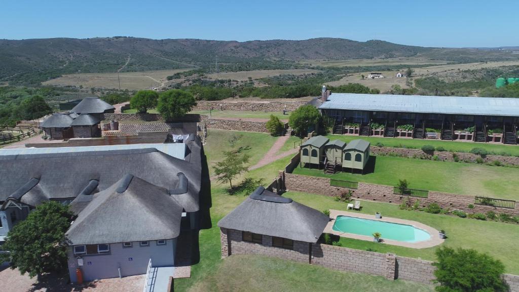 an aerial view of a house with a swimming pool at Outeniquabosch Lodge in Hartenbos