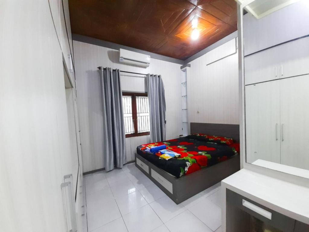 Postel nebo postele na pokoji v ubytování Mocca Guest House