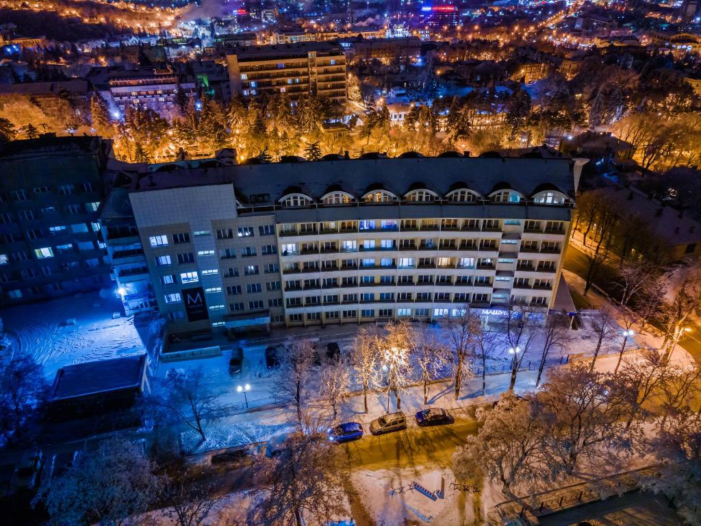 an aerial view of a building at night at Hotel Mashuk in Pyatigorsk