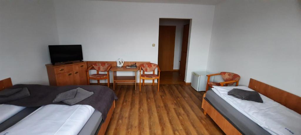 Postel nebo postele na pokoji v ubytování Dom Wczasowy Larix