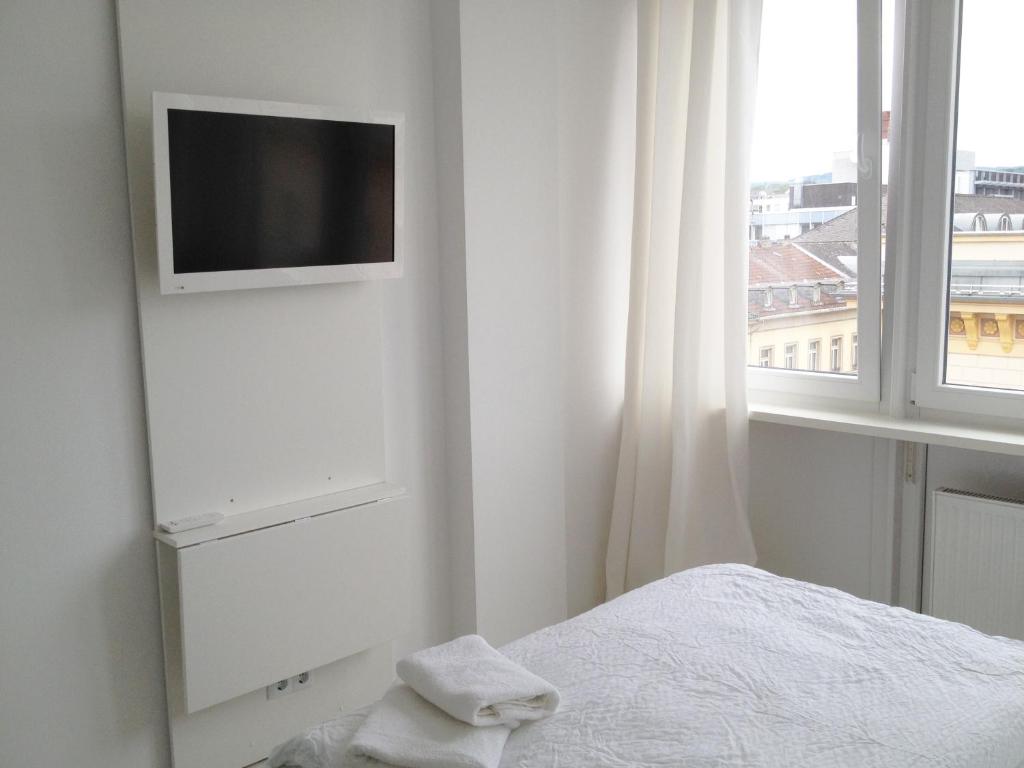 Postel nebo postele na pokoji v ubytování Business Hostel Wiesbaden ONE