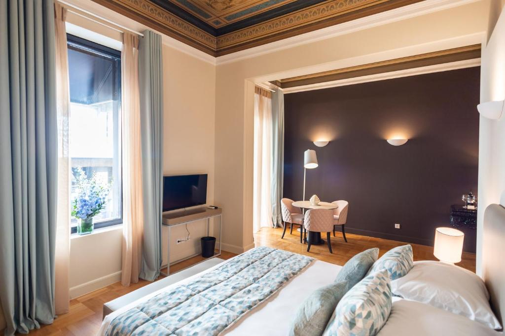 Posteľ alebo postele v izbe v ubytovaní 33SolonosSuites