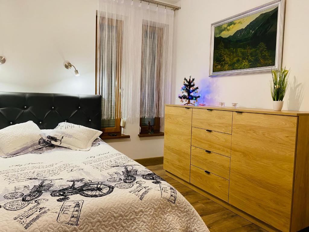 Posteľ alebo postele v izbe v ubytovaní Apartament Rodzinny Gubałówka