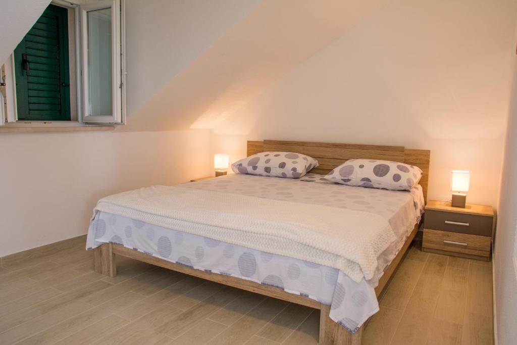 Postel nebo postele na pokoji v ubytování Apartment Ma_Lu