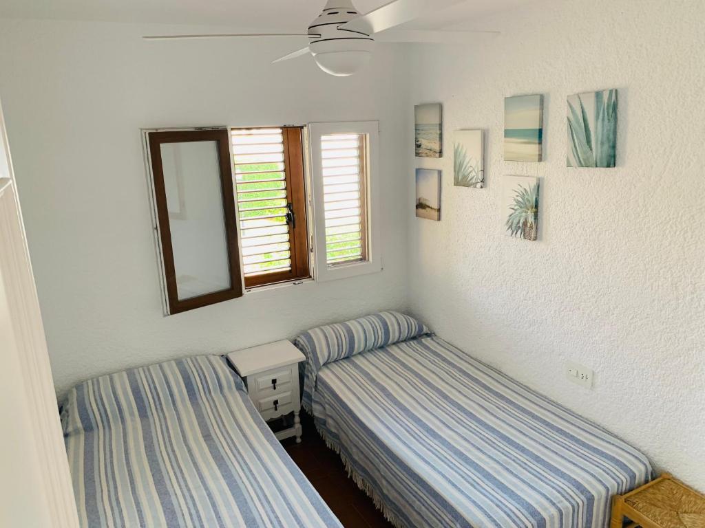 Postel nebo postele na pokoji v ubytování CASA DUPLEX BUNGALOW Dénia