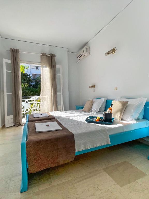 Postel nebo postele na pokoji v ubytování Stratos Hotel