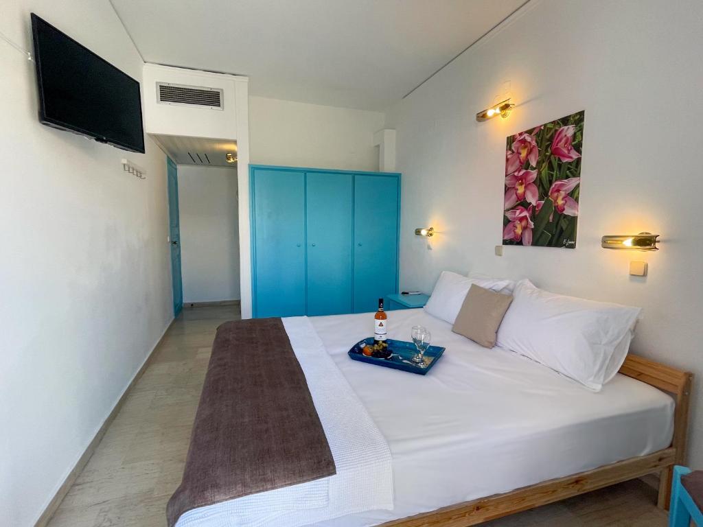 Postel nebo postele na pokoji v ubytování Stratos Hotel