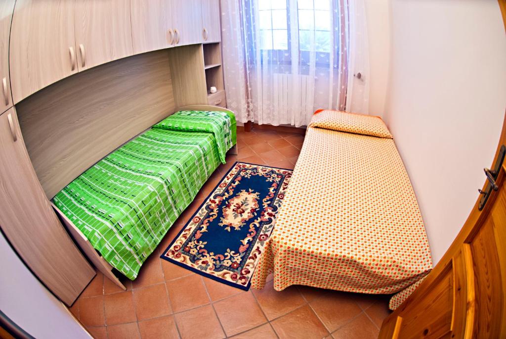 Postel nebo postele na pokoji v ubytování Perrone Apartments