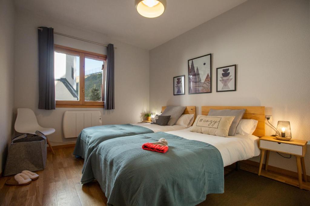 Voodi või voodid majutusasutuse PirineosK · GORGOL · Confort y funcionalidad · con balcón toas