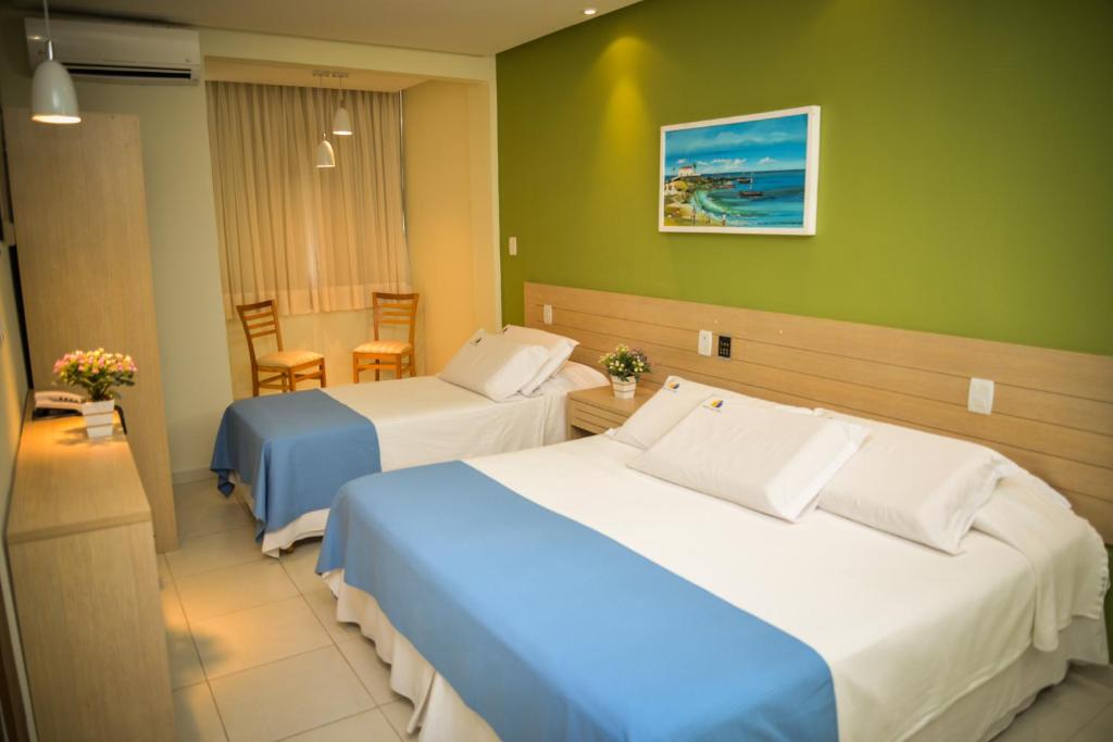 Postel nebo postele na pokoji v ubytování Hit Hotel