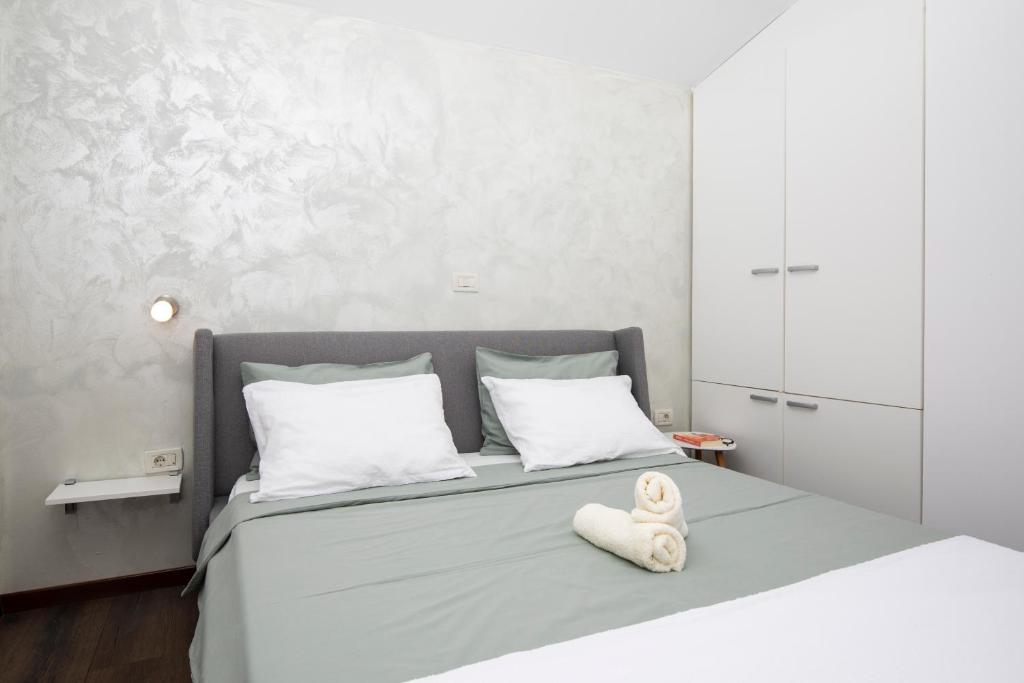 Łóżko lub łóżka w pokoju w obiekcie Sandy Bay Apartments - free mountainbike rental -