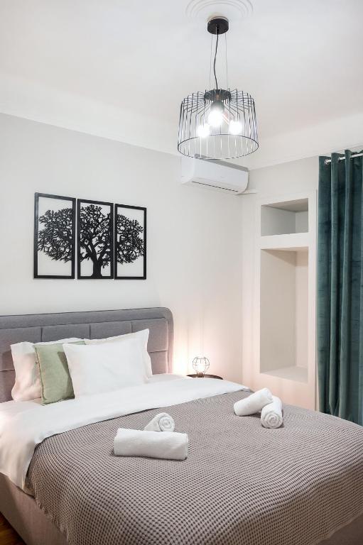 Łóżko lub łóżka w pokoju w obiekcie Porto Sea View Apartments - Kypriou