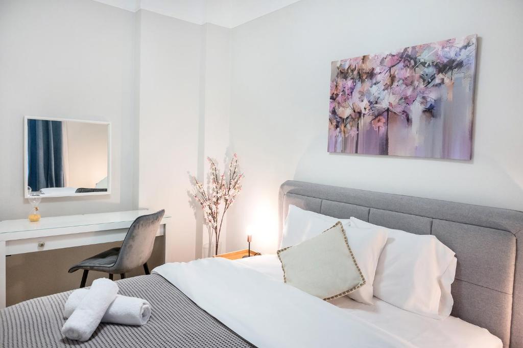 Łóżko lub łóżka w pokoju w obiekcie Porto Sea View Apartments - Kypriou