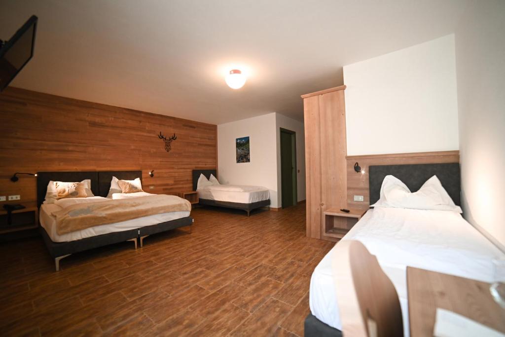 Postel nebo postele na pokoji v ubytování Albergo Sporting