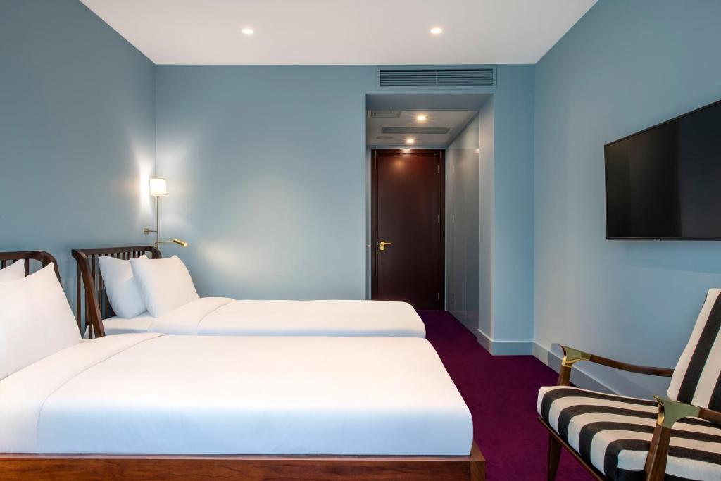 TV a/nebo společenská místnost v ubytování Bazzar Boutique Hotel