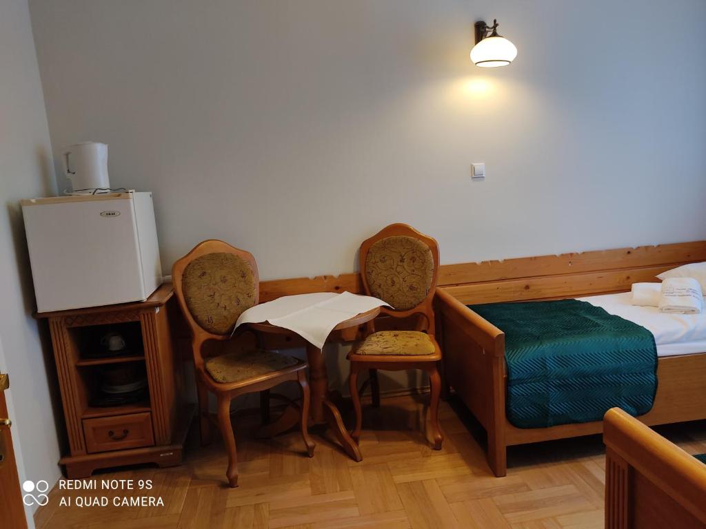 Posteľ alebo postele v izbe v ubytovaní Pokoje Gościnne Zakopane