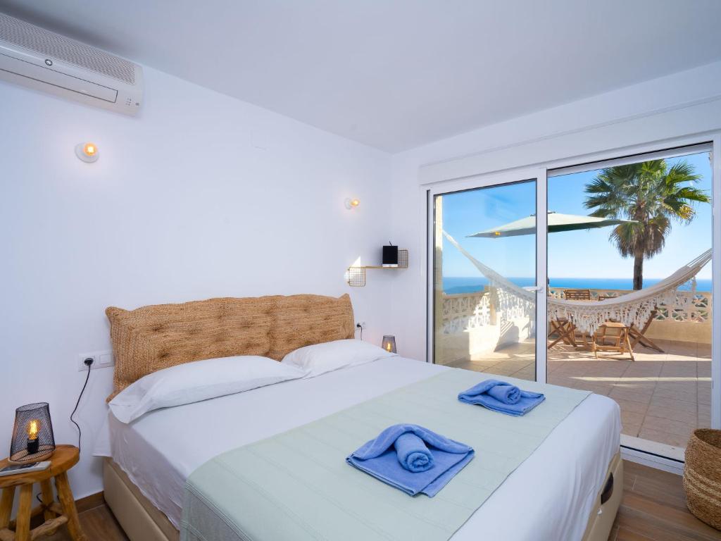 A bed or beds in a room at Holiday Home La Begonia by Interhome