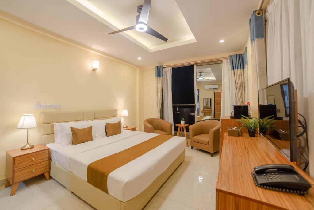 Postel nebo postele na pokoji v ubytování Amber Beach Hotel