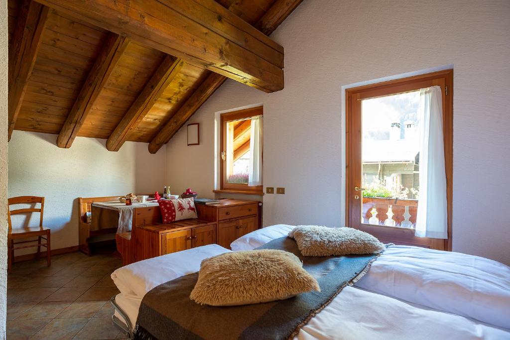 Postel nebo postele na pokoji v ubytování Residence Monterosa
