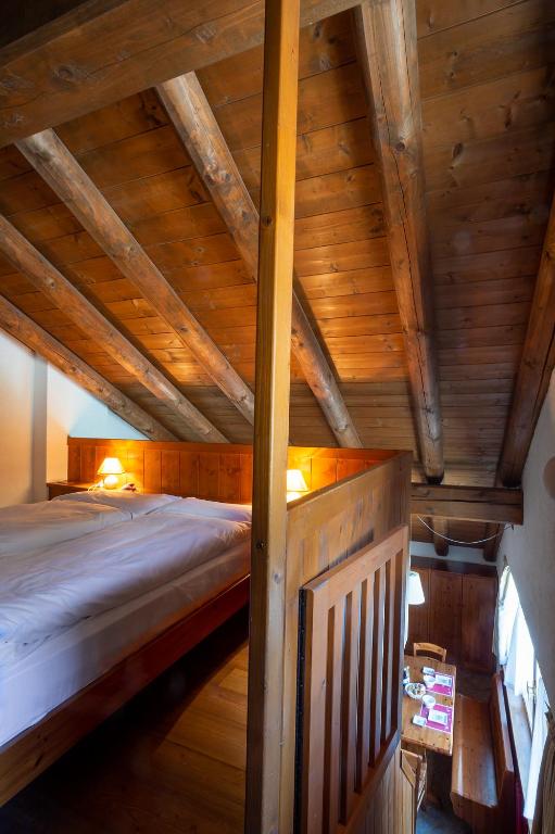 Postel nebo postele na pokoji v ubytování Residence Monterosa