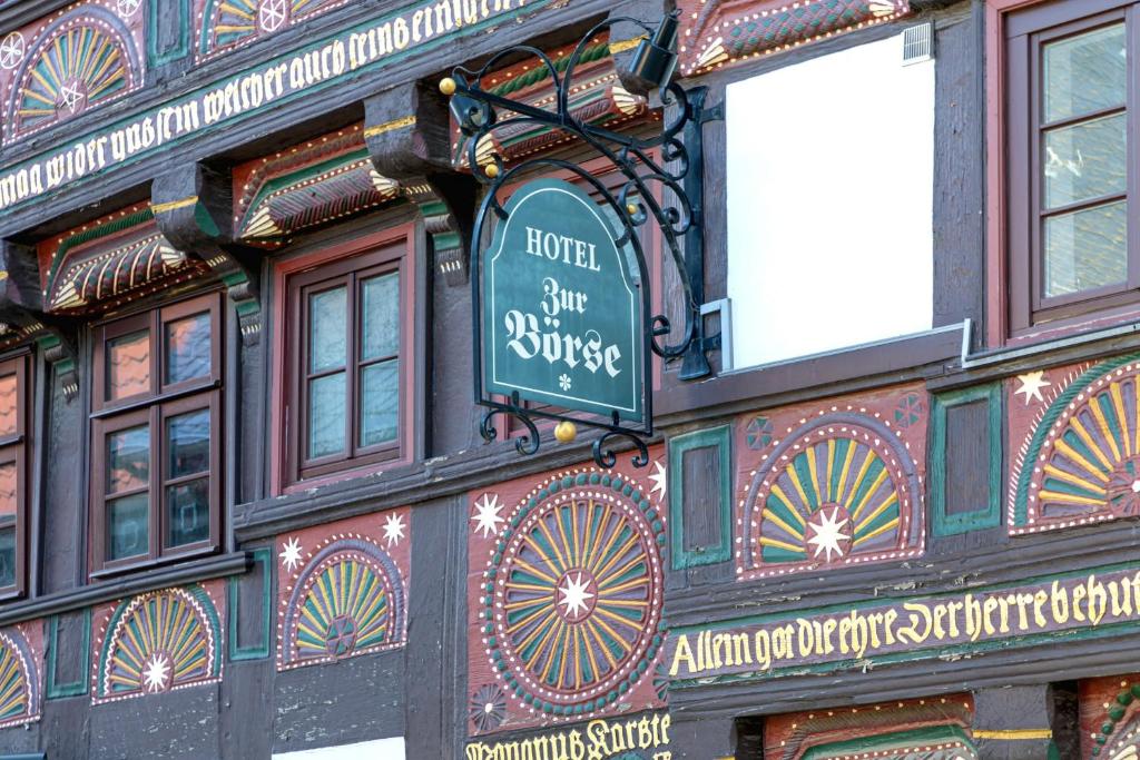 a building with a sign on the side of it at Altstadthotel Zur Börse in Goslar