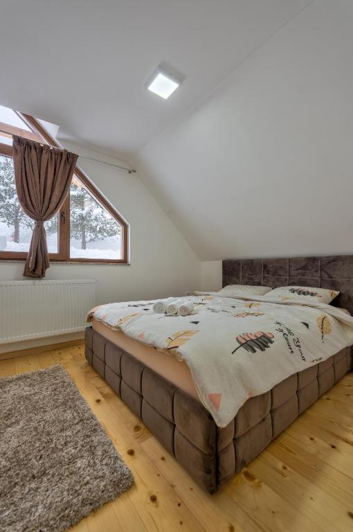 Postel nebo postele na pokoji v ubytování Idila Zaovinskog jezera