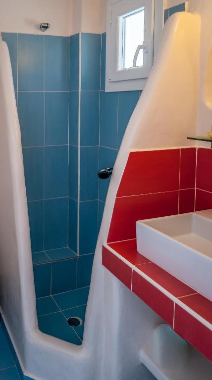 a bathroom with a sink and a shower at Paleochori Studios in Paliochori
