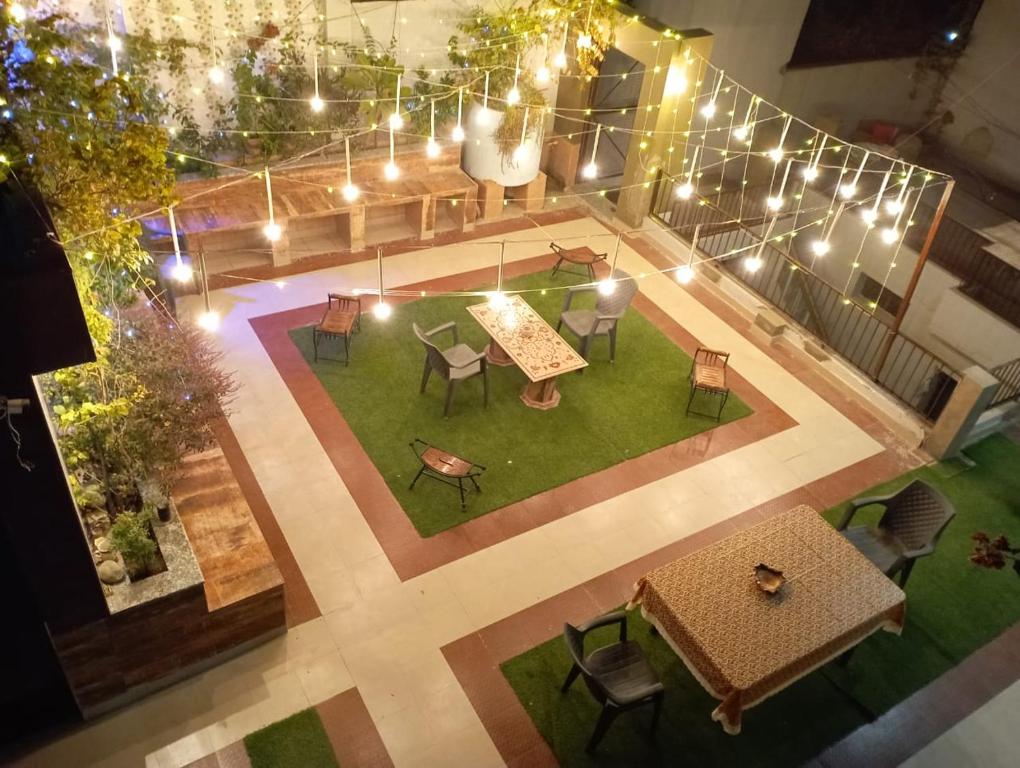 an overhead view of a patio with tables and chairs at The Hideout Agra - Boutique Homestay near Taj in Agra
