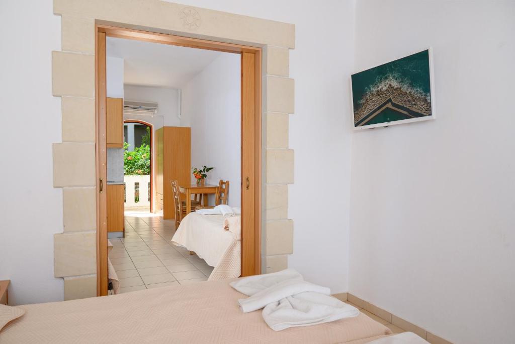 Postel nebo postele na pokoji v ubytování Adonis Hotel