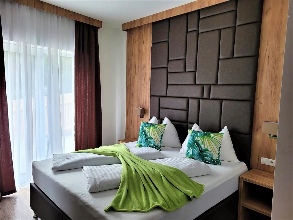 Postel nebo postele na pokoji v ubytování Sylpaulerhof Aparthotel