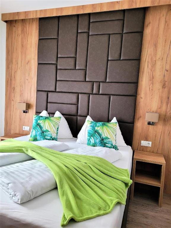 Postel nebo postele na pokoji v ubytování Sylpaulerhof Aparthotel