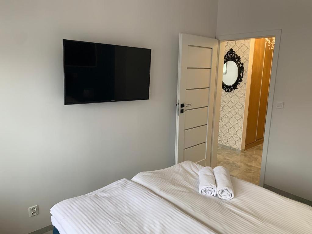 Posteľ alebo postele v izbe v ubytovaní Apartament Rysy ApartamentyZakopianskie Basen Sauna Jacuzzi