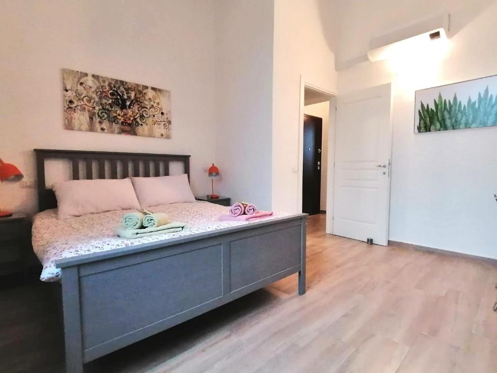 Llit o llits en una habitació de Casa Sansevera Lucca