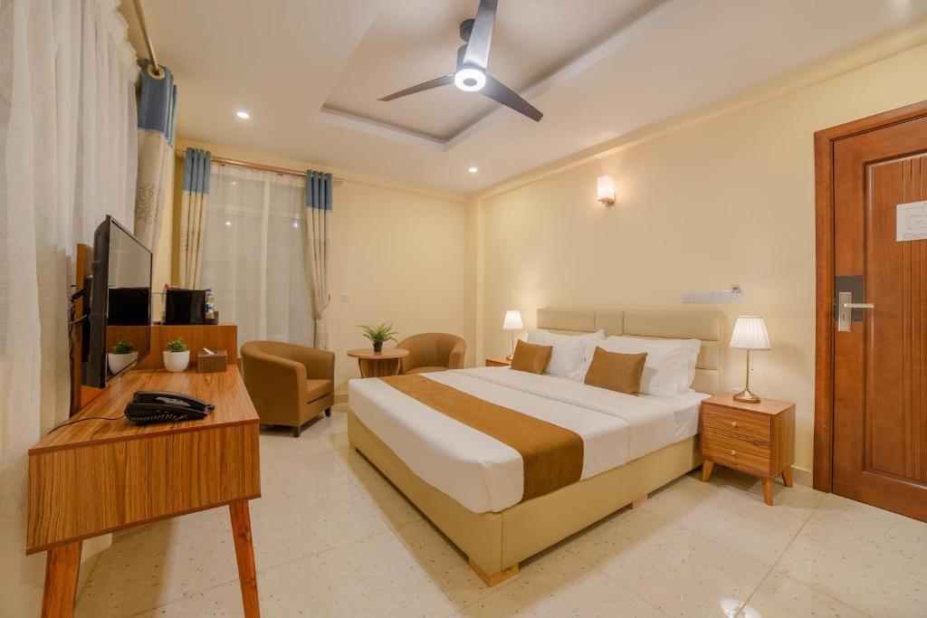 Postel nebo postele na pokoji v ubytování Amber Beach Hotel