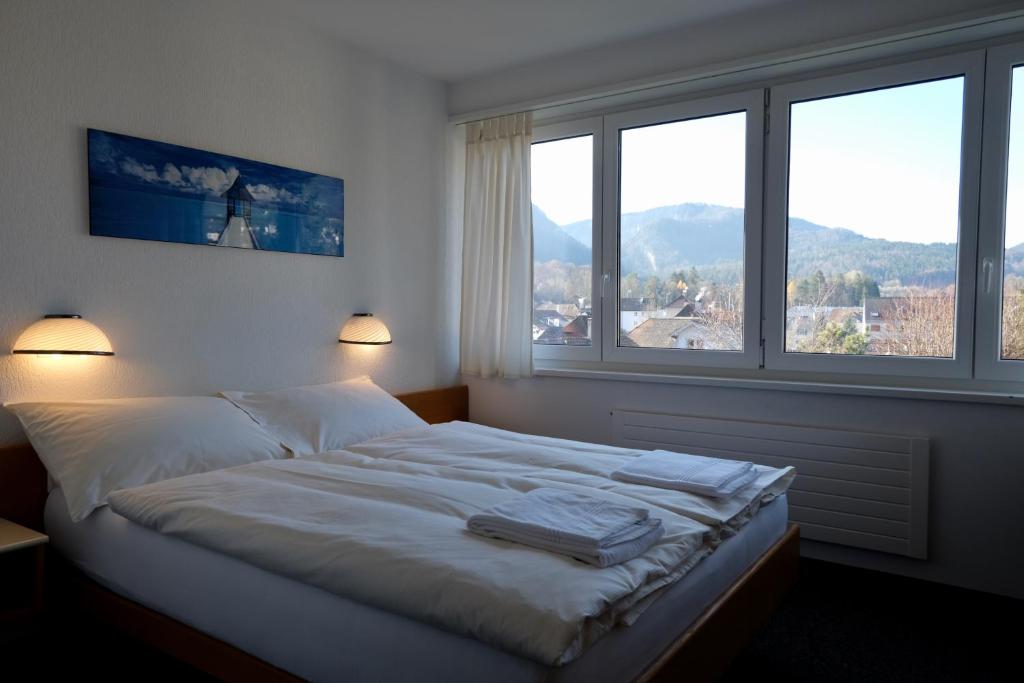 Postel nebo postele na pokoji v ubytování Hôtel Oasis