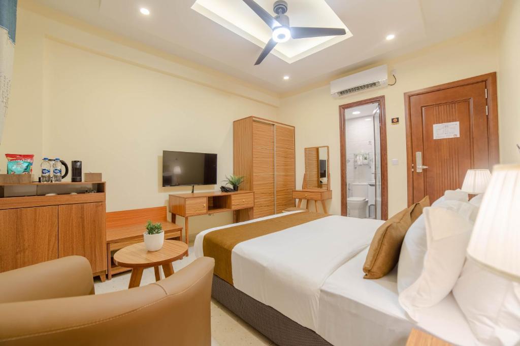 TV a/nebo společenská místnost v ubytování Amber Beach Hotel