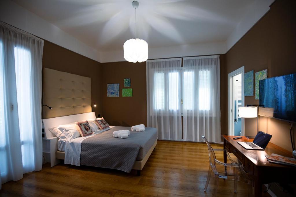 Un pat sau paturi într-o cameră la Villa Calipso