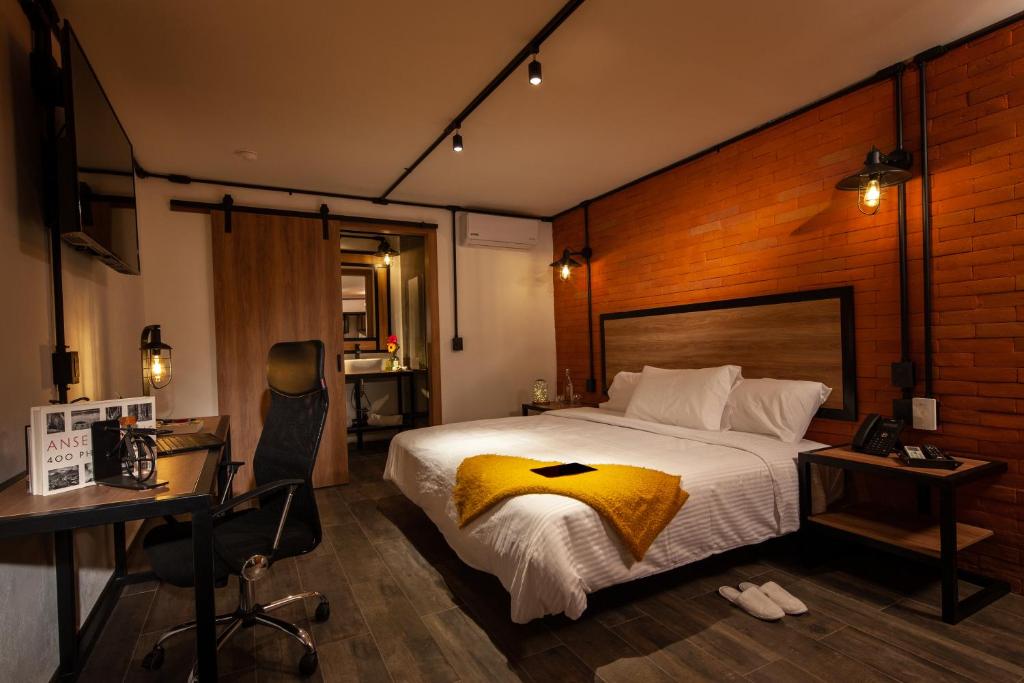Postel nebo postele na pokoji v ubytování Hotel Brök San Juan del Río