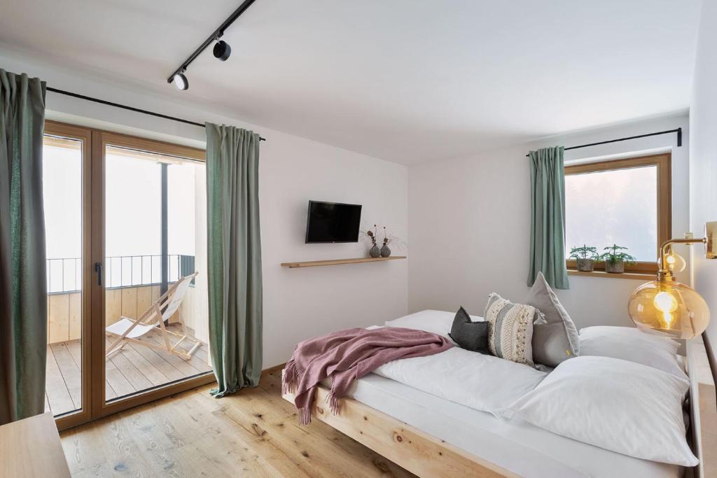 Letto o letti in una camera di Holzhackerin - the charming Haus am Berg