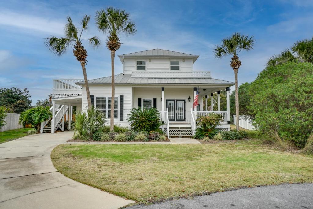 a white house with palm trees in front of it at 30A Beach House - Walking on Sunshine in Inlet Beach