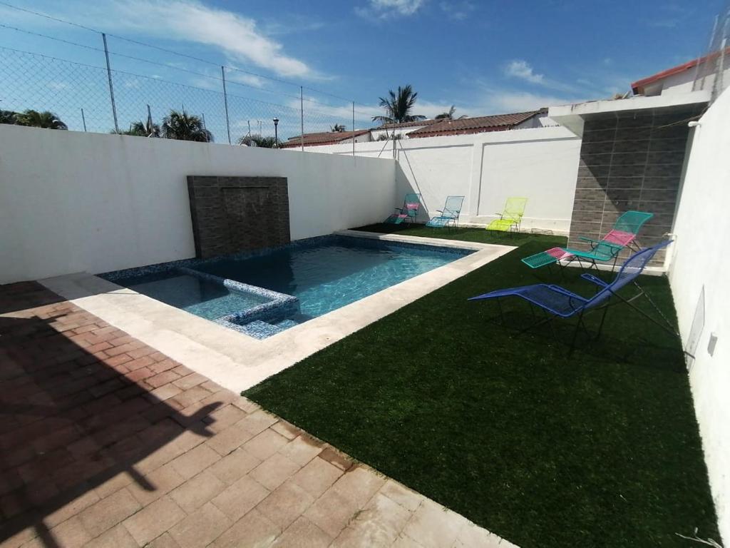Bazén v ubytování ACAPULCO DIAMANTE NUEVA E INCREIBLE VILLA CON ALBERCA PROPIA nebo v jeho okolí