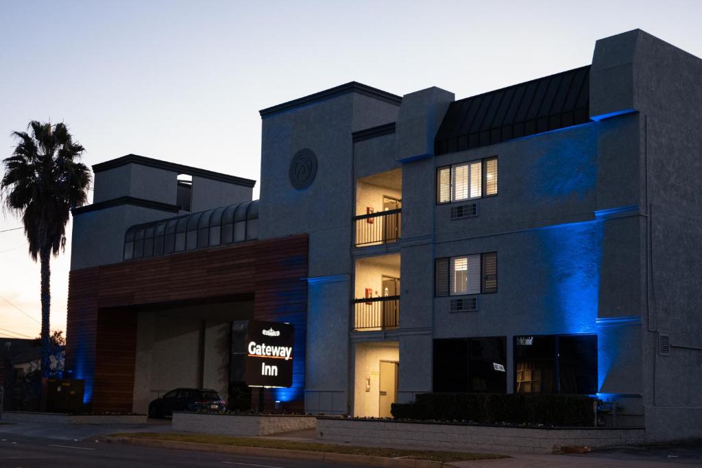 a building with a blue light on it at Gateway Inn Gardena Los Angeles South in Gardena