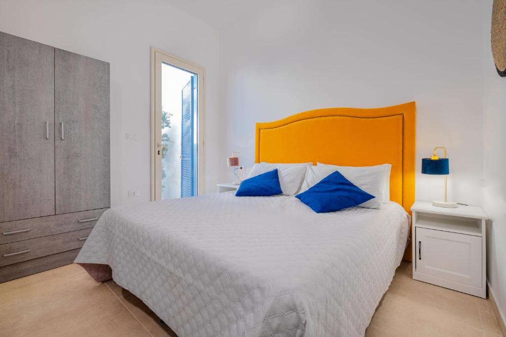 Postel nebo postele na pokoji v ubytování Villette Lux Fronte Spiaggia - Torre Pali